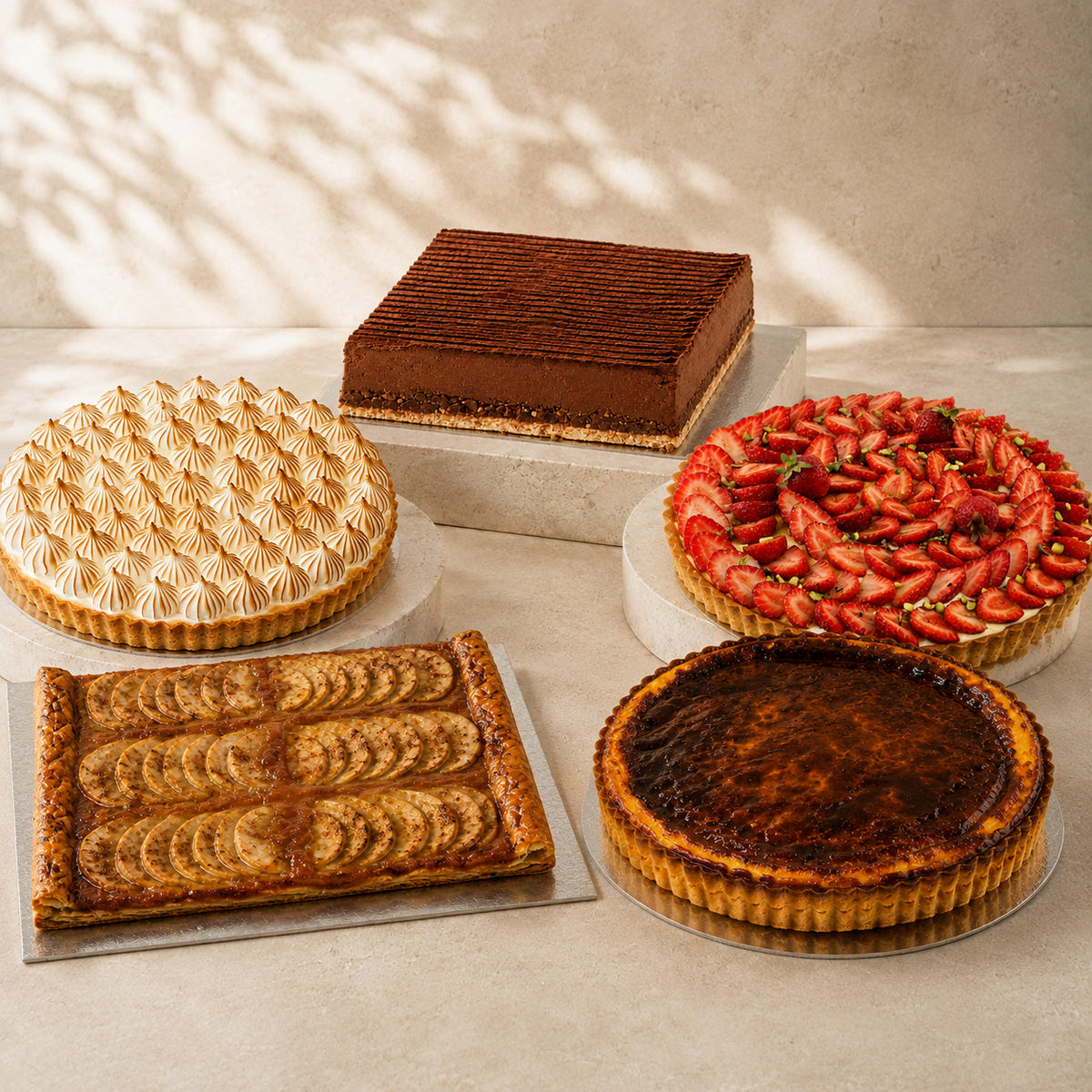 A selection of French celebration cakes and tarts from Les Deux Coqs